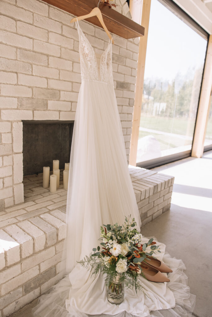 Wedding dress on the mantel at the White Poplar Wedding Venue in Winnipeg