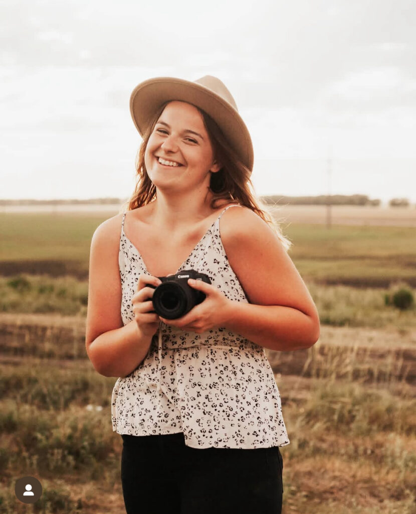 Young Manitoba photographer with her first DSLR camera, beginning her photography journey.